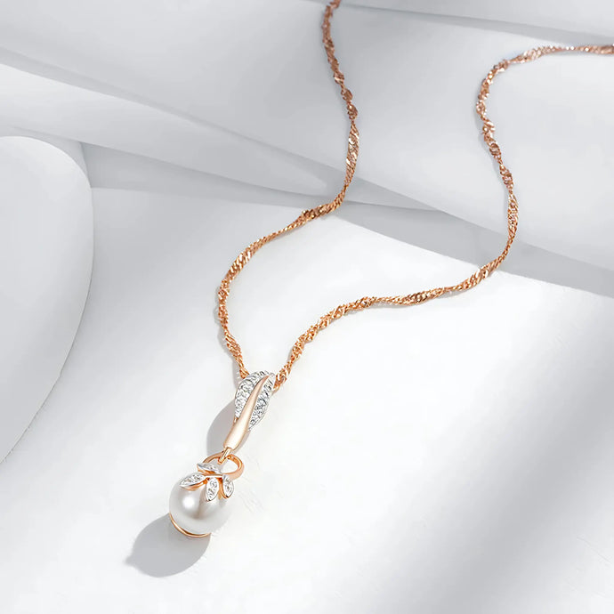Full display of the Crystal Flower Pearl Pendant Necklace laid on white fabric.