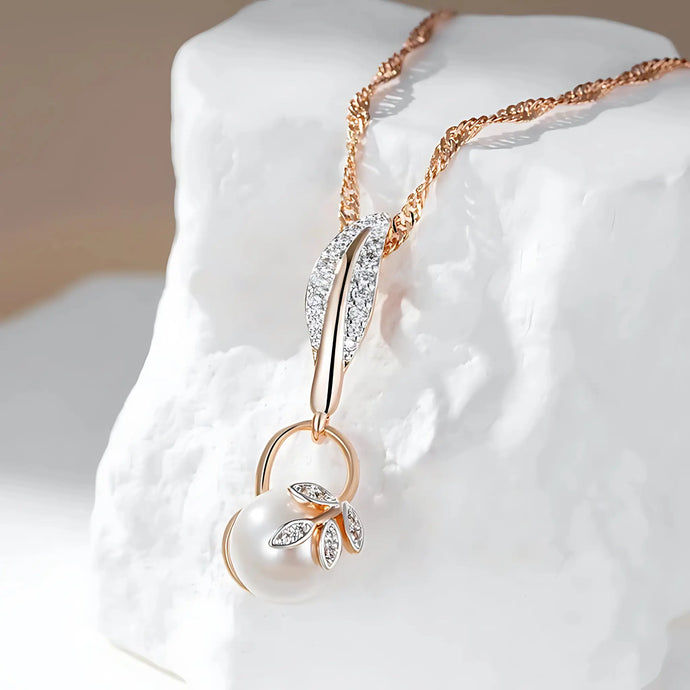 Crystal Flower Pearl Pendant Necklace showcased on a textured white stone background.