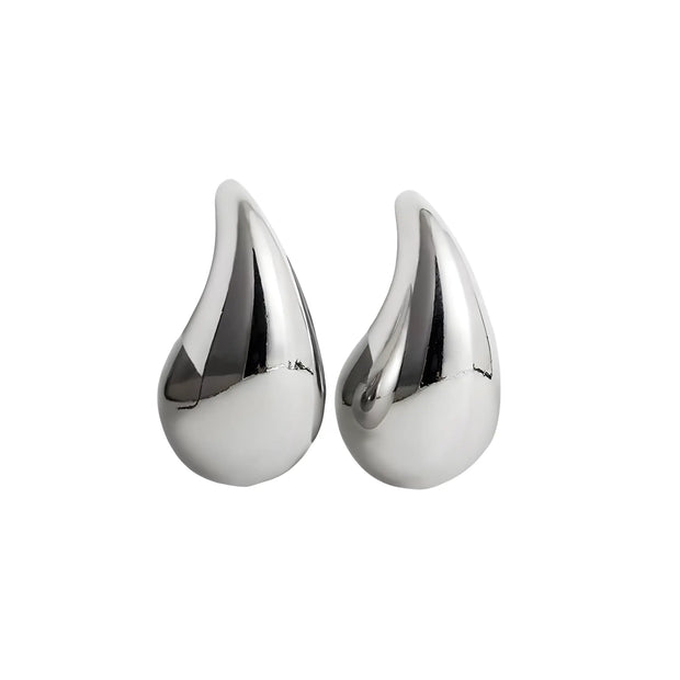Pair of silver teardrop-shaped earrings on a white background