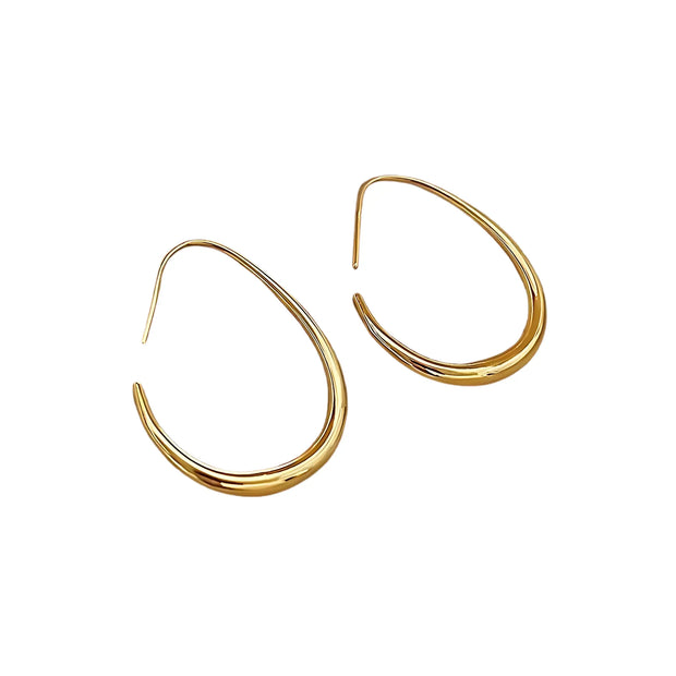 Sleek gold crescent hoop earrings with a modern open design