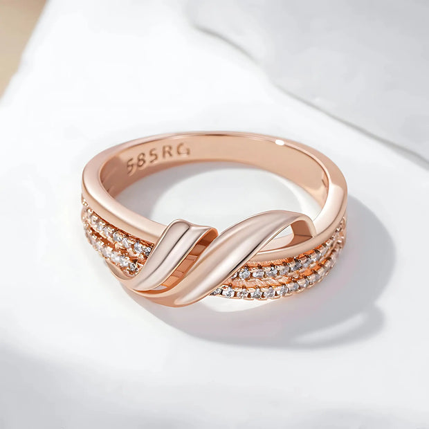 Angled shot of the Rose Gold Crossover Band Ring highlighting its intertwined rose gold bands and elegant zircon details.
