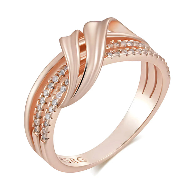 Rose gold ring with diamond accents on a white background