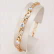 Side view of Rose Gold Sparkle Link Bracelet with infinity-inspired links and cubic zirconia accents.