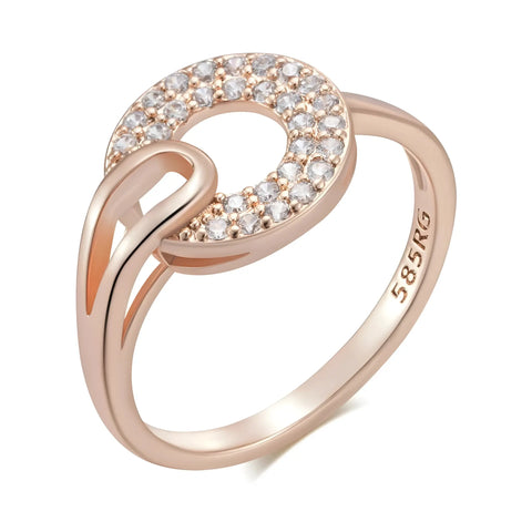 Rose gold ring with diamond accents on a white background