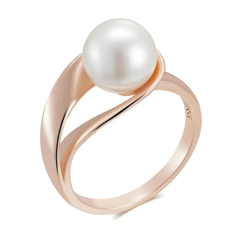 Rose gold ring with a pearl on a white background